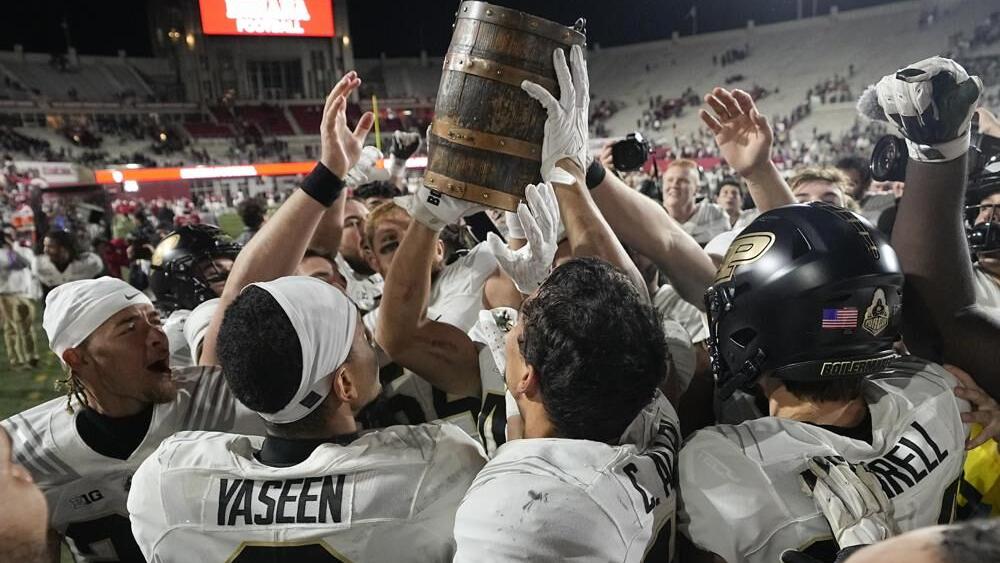 Purdue football team celebrates with the Old Oaken Bucket.jpeg